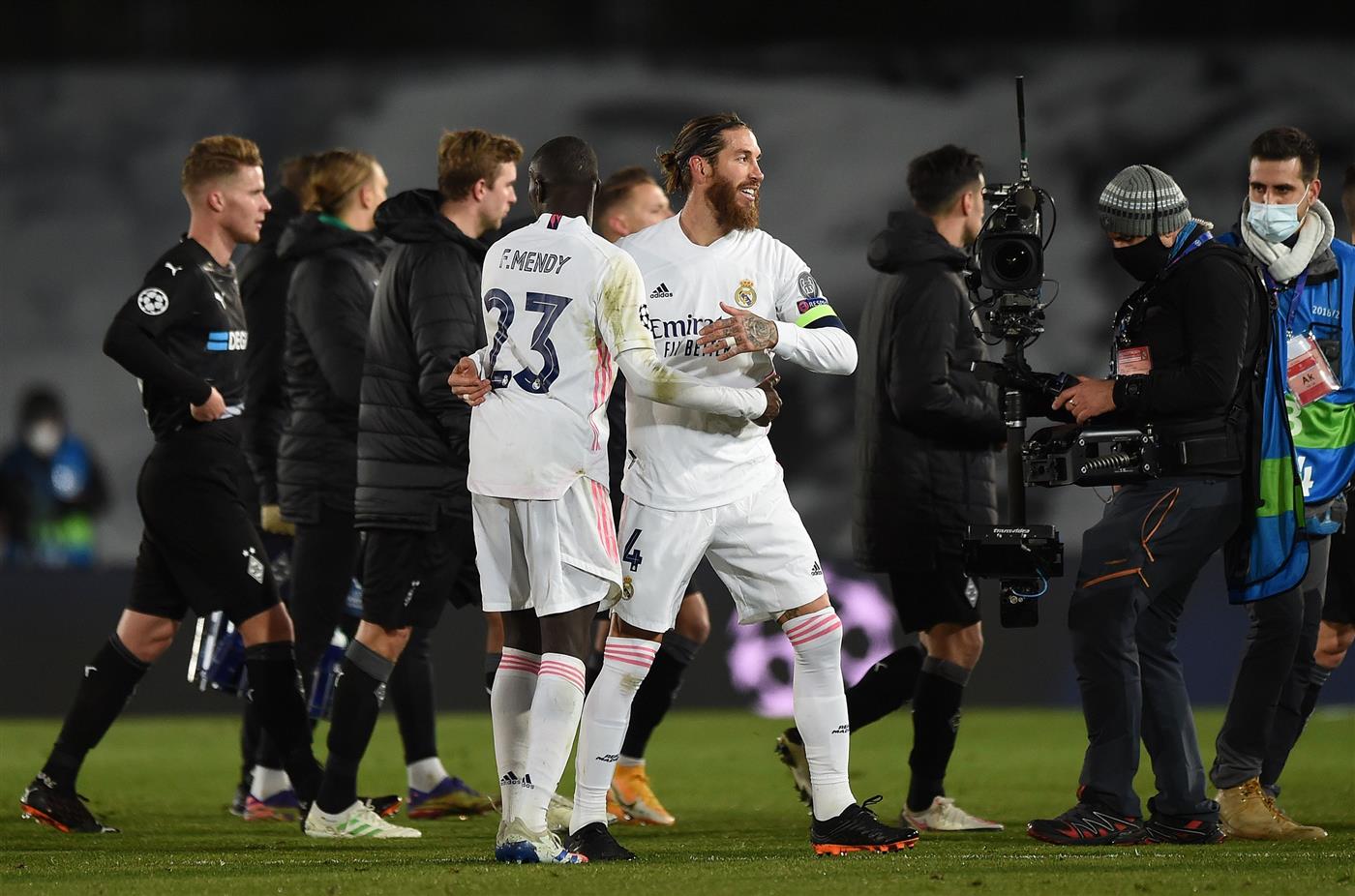 MADRID, SPAIN - DECEMBER 09: Sergio Ramos and Ferland Mendy of Real Madrid celebrate following the UEFA Champions League Group B stage match between Real Madrid and Borussia Moenchengladbach at Estadio Alfredo di Stefano on December 09, 2020 in Madrid, Spain. Sporting stadiums around Spain remain under strict restrictions due to the Coronavirus Pandemic as Government social distancing laws prohibit fans inside venues resulting in games being played behind closed doors. (Photo by Denis Doyle/Getty Images)