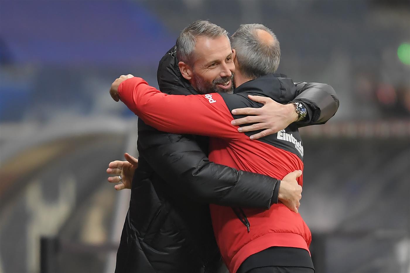 FRANKFURT AM MAIN, GERMANY - DECEMBER 15: Adi Hutter, Head Coach of Eintracht Frankfurt embraces Marco Rose, Head Coach of Borussia Monchengladbach prior to the Bundesliga match between Eintracht Frankfurt and Borussia Moenchengladbach at Deutsche Bank Park on December 15, 2020 in Frankfurt am Main, Germany. Sporting stadiums around Germany remain under strict restrictions due to the Coronavirus Pandemic as Government social distancing laws prohibit fans inside venues resulting in games being played behind closed doors. (Photo by Alexander Scheuber/Getty Images)