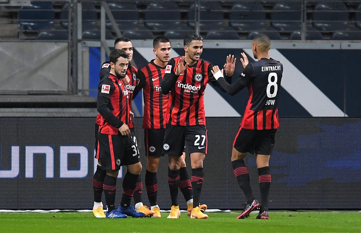 FRANKFURT AM MAIN, GERMANY - DECEMBER 15: Andre Silva of Eintracht Frankfurt celebrates with teammates after scoring their team