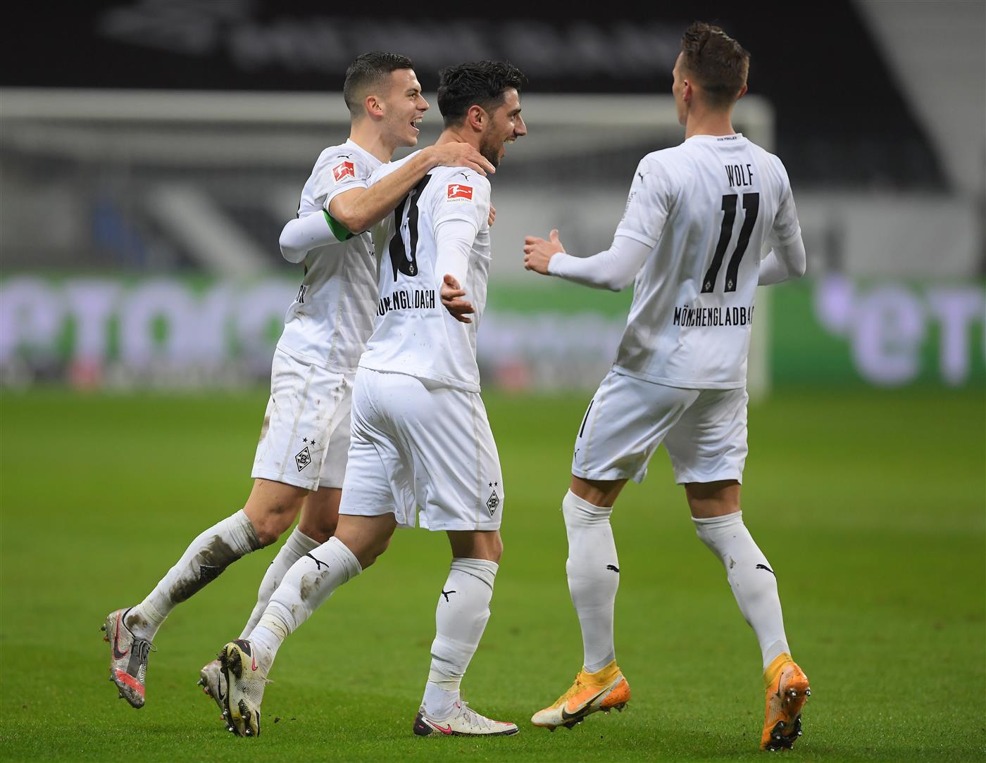 FRANKFURT AM MAIN, GERMANY - DECEMBER 15: Lars Stindl of Borussia Monchengladbach celebrates with teammate Hannes Wolf after scoring his sides first goal during the Bundesliga match between Eintracht Frankfurt and Borussia Moenchengladbach at Deutsche Bank Park on December 15, 2020 in Frankfurt am Main, Germany. Sporting stadiums around Germany remain under strict restrictions due to the Coronavirus Pandemic as Government social distancing laws prohibit fans inside venues resulting in games being played behind closed doors. (Photo by Alexander Scheuber/Getty Images)