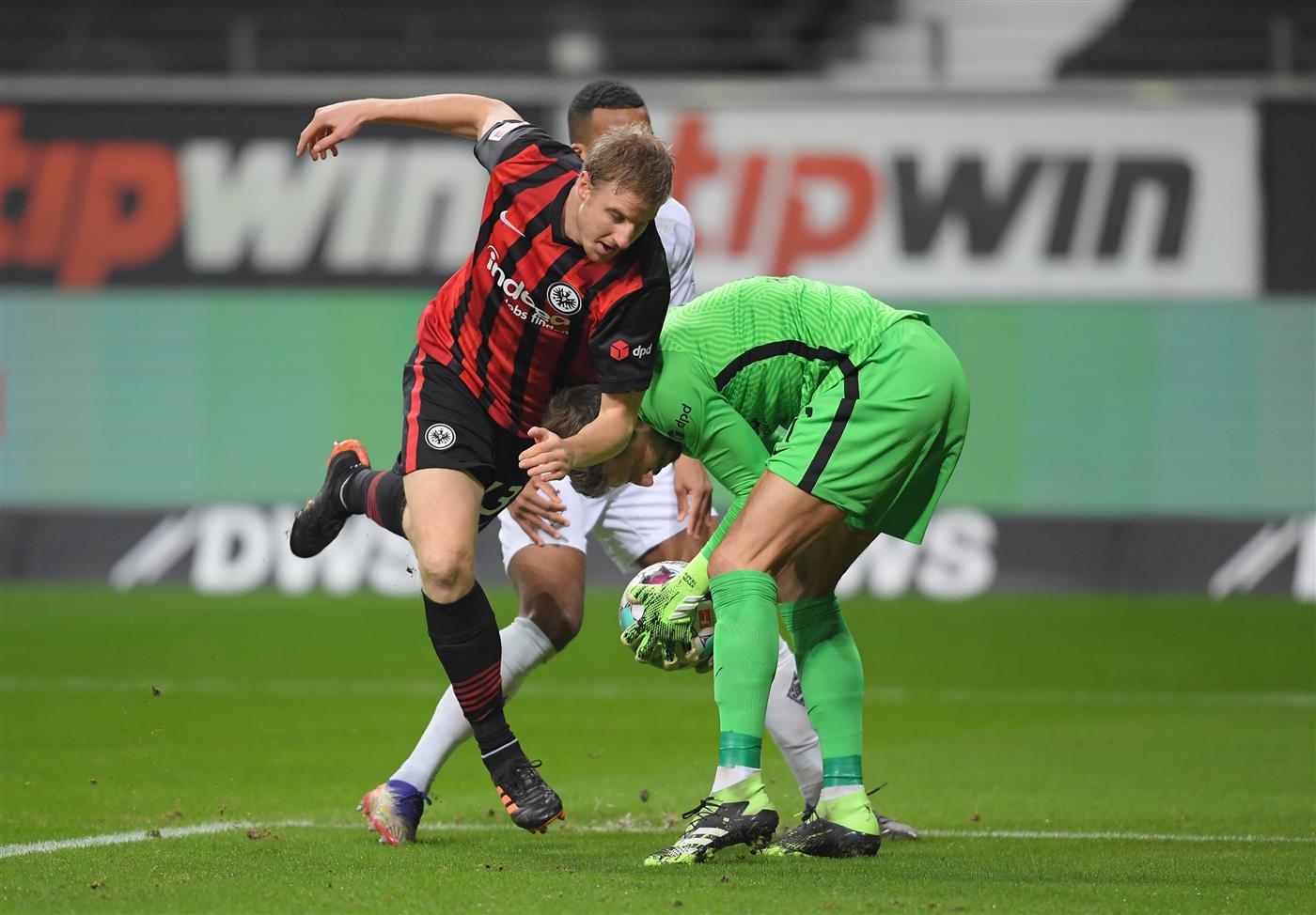 FRANKFURT AM MAIN, GERMANY - DECEMBER 15: Martin Hinteregger of Eintracht Frankfurt collides with teammate Kevin Trapp during the Bundesliga match between Eintracht Frankfurt and Borussia Moenchengladbach at Deutsche Bank Park on December 15, 2020 in Frankfurt am Main, Germany. Sporting stadiums around Germany remain under strict restrictions due to the Coronavirus Pandemic as Government social distancing laws prohibit fans inside venues resulting in games being played behind closed doors. (Photo by Alexander Scheuber/Getty Images)