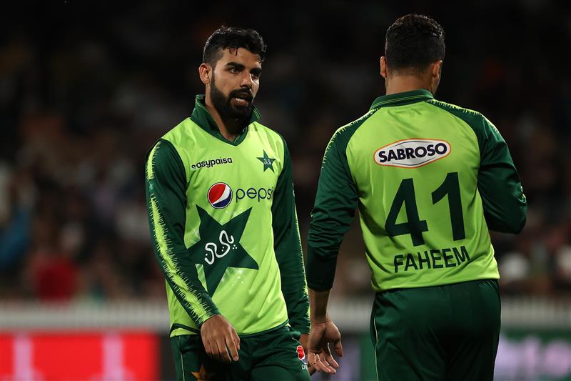 HAMILTON, NEW ZEALAND - DECEMBER 20: Shadab Khan captain of Pakistan motivates Faheem Ashraf of Pakistan
 for the last over during game two of the International T20 series between New Zealand and Pakistan at Seddon Park on December 20, 2020 in Hamilton, New Zealand. (Photo by Fiona Goodall/Getty Images)
