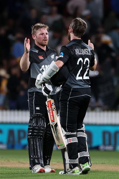 HAMILTON, NEW ZEALAND - DECEMBER 20: Tim Seifert of New Zealand  (L) and Kane Williamson, captain of New Zealand  celebrate the win during game two of the International T20 series between New Zealand and Pakistan at Seddon Park on December 20, 2020 in Hamilton, New Zealand. (Photo by Fiona Goodall/Getty Images)