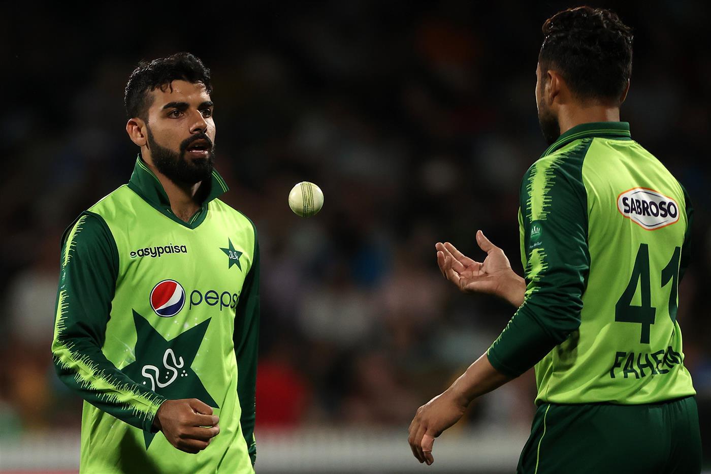 HAMILTON, NEW ZEALAND - DECEMBER 20: Shadab Khan captain of Pakistan motivates Faheem Ashraf of Pakistan
 for the last over during game two of the International T20 series between New Zealand and Pakistan at Seddon Park on December 20, 2020 in Hamilton, New Zealand. (Photo by Fiona Goodall/Getty Images)