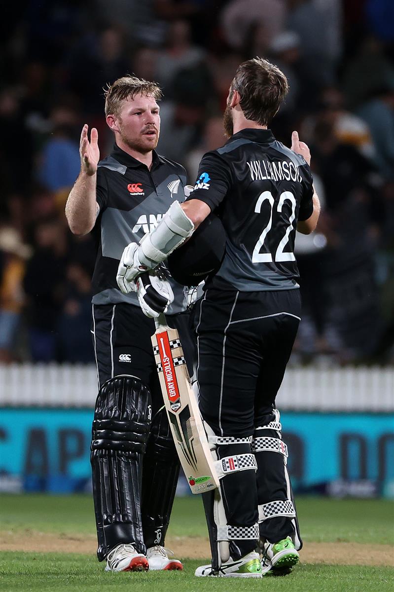 HAMILTON, NEW ZEALAND - DECEMBER 20: Tim Seifert of New Zealand  (L) and Kane Williamson, captain of New Zealand  celebrate the win during game two of the International T20 series between New Zealand and Pakistan at Seddon Park on December 20, 2020 in Hamilton, New Zealand. (Photo by Fiona Goodall/Getty Images)