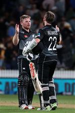 HAMILTON, NEW ZEALAND - DECEMBER 20: Tim Seifert of New Zealand  (L) and Kane Williamson, captain of New Zealand  celebrate the win during game two of the International T20 series between New Zealand and Pakistan at Seddon Park on December 20, 2020 in Hamilton, New Zealand. (Photo by Fiona Goodall/Getty Images)