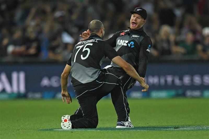 NAPIER, NEW ZEALAND - DECEMBER 22: Daryl Mitchell and Glenn Phillips of New Zealand celebrate a wicket during the third game of the International T20 series between New Zealand and Pakistan at McLean Park on December 22, 2020 in Napier, New Zealand. (Photo by Kerry Marshall/Getty Images)