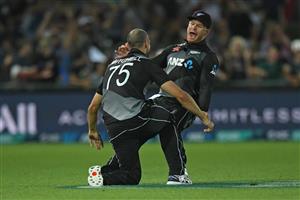 NAPIER, NEW ZEALAND - DECEMBER 22: Daryl Mitchell and Glenn Phillips of New Zealand celebrate a wicket during the third game of the International T20 series between New Zealand and Pakistan at McLean Park on December 22, 2020 in Napier, New Zealand. (Photo by Kerry Marshall/Getty Images)