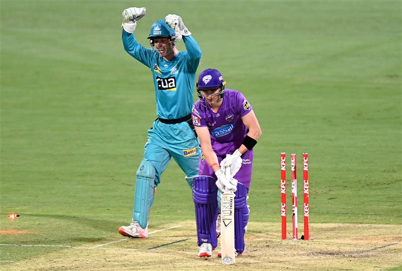 BRISBANE, AUSTRALIA - DECEMBER 30: Wil Parker of the Hurricanes is clean bowled by Mujeeb Ur Rahman of the Heat during the Big Bash League match between the Hobart Hurricanes and Brisbane Heat at The Gabba, on December 30, 2020, in Brisbane, Australia. (Photo by Bradley Kanaris/Getty Images)