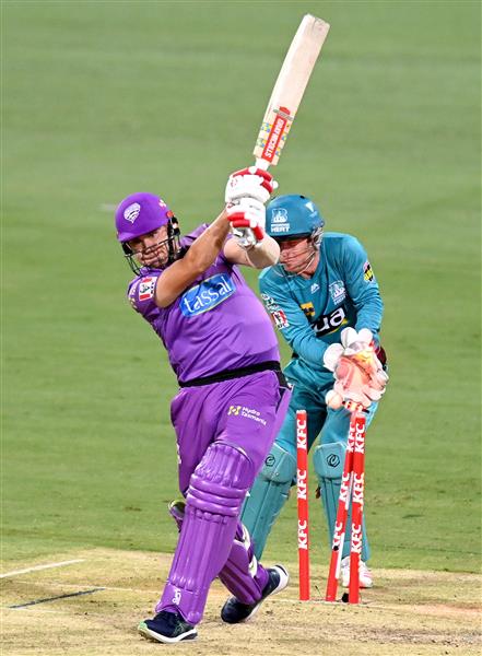 BRISBANE, AUSTRALIA - DECEMBER 30: Scott Bolland of the Hurricanes is bowled out by Mujeeb Ur Rahman of the Heat during the Big Bash League match between the Hobart Hurricanes and Brisbane Heat at The Gabba, on December 30, 2020, in Brisbane, Australia. (Photo by Bradley Kanaris/Getty Images)