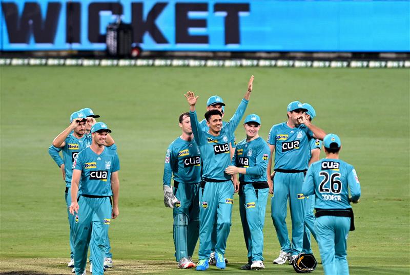 BRISBANE, AUSTRALIA - DECEMBER 30: Mujeeb Ur Rahman of the Heat celebrates taking the wicket of Scott Bolland of the Hurricanes during the Big Bash League match between the Hobart Hurricanes and Brisbane Heat at The Gabba, on December 30, 2020, in Brisbane, Australia. (Photo by Bradley Kanaris/Getty Images)