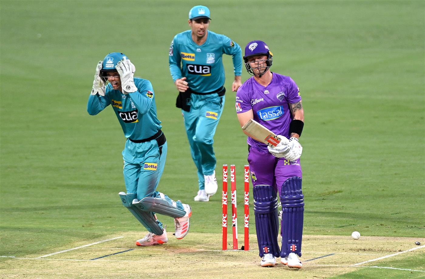 BRISBANE, AUSTRALIA - DECEMBER 30: Ben McDermott of the Hurricanes is bowled out by Mujeeb Ur Rahman of the Heat during the Big Bash League match between the Hobart Hurricanes and Brisbane Heat at The Gabba, on December 30, 2020, in Brisbane, Australia. (Photo by Bradley Kanaris/Getty Images)