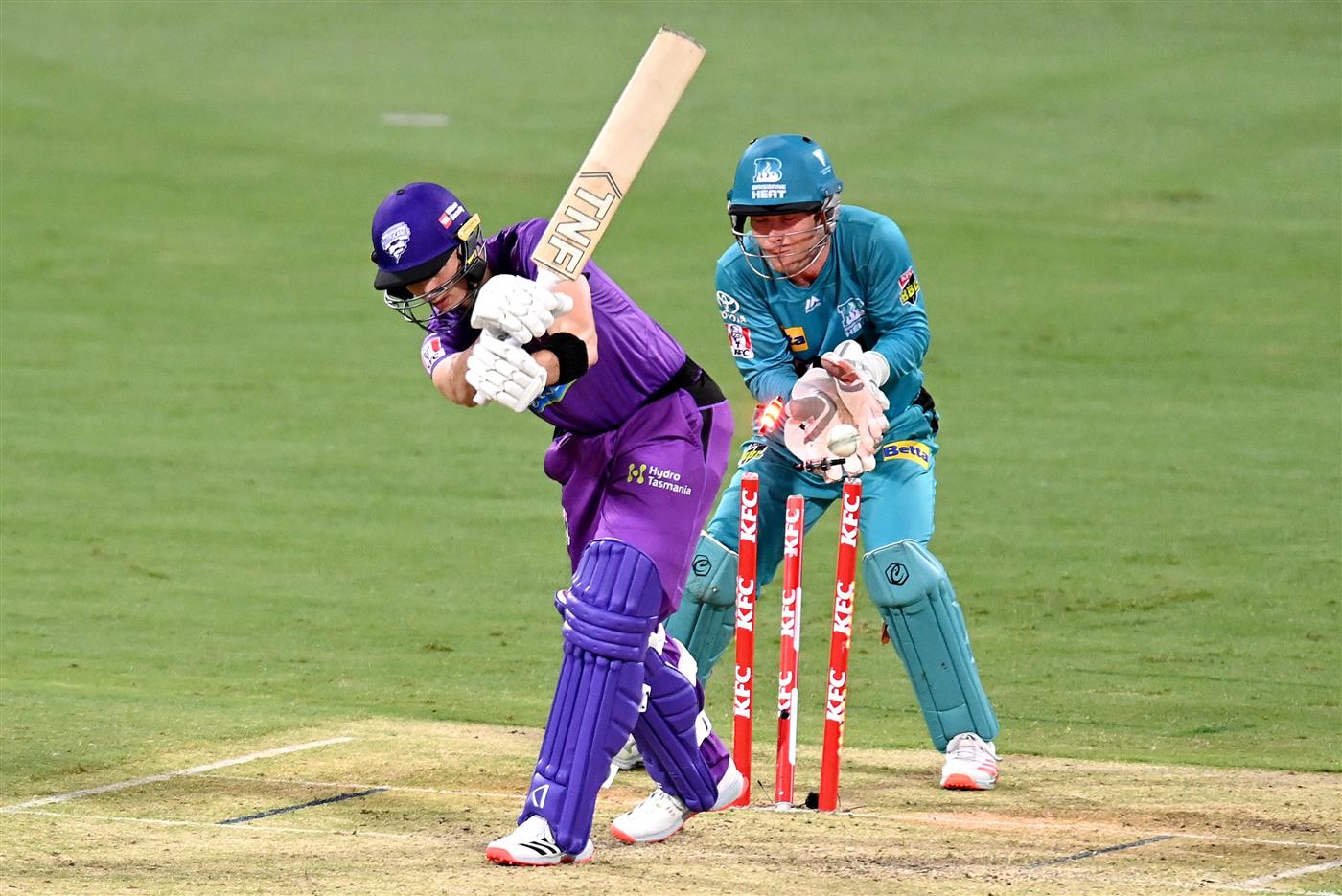 BRISBANE, AUSTRALIA - DECEMBER 30: Wil Parker of the Hurricanes is clean bowled by Mujeeb Ur Rahman of the Heat during the Big Bash League match between the Hobart Hurricanes and Brisbane Heat at The Gabba, on December 30, 2020, in Brisbane, Australia. (Photo by Bradley Kanaris/Getty Images)