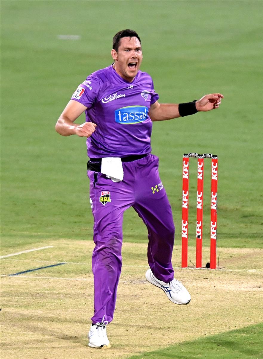 BRISBANE, AUSTRALIA - DECEMBER 30: Scott Bolland of the Hurricanes celebrates taking the wicket of Jack Wildermuth of the Heat during the Big Bash League match between the Hobart Hurricanes and Brisbane Heat at The Gabba, on December 30, 2020, in Brisbane, Australia. (Photo by Bradley Kanaris/Getty Images)