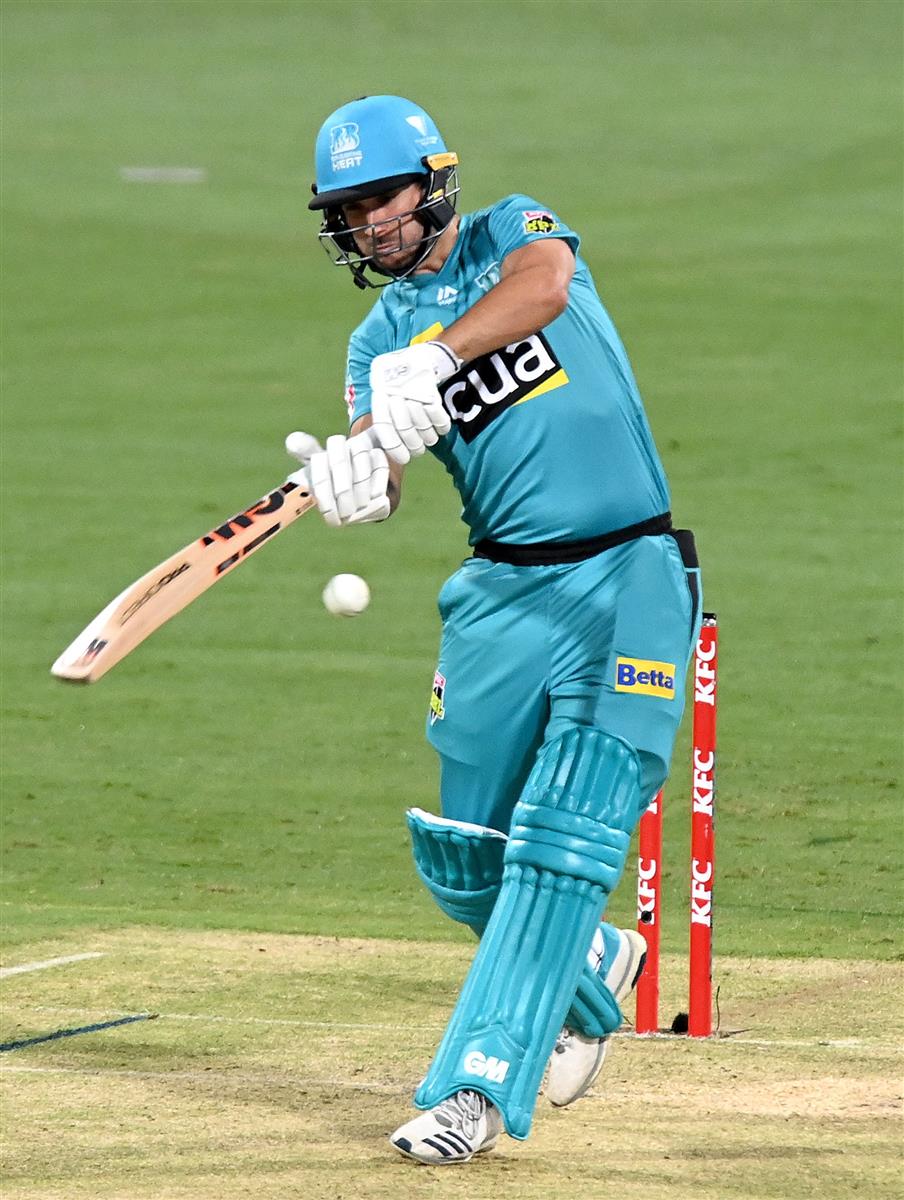 BRISBANE, AUSTRALIA - DECEMBER 30: Lewis Gregory of the Heat plays a shot during the Big Bash League match between the Hobart Hurricanes and Brisbane Heat at The Gabba, on December 30, 2020, in Brisbane, Australia. (Photo by Bradley Kanaris/Getty Images)