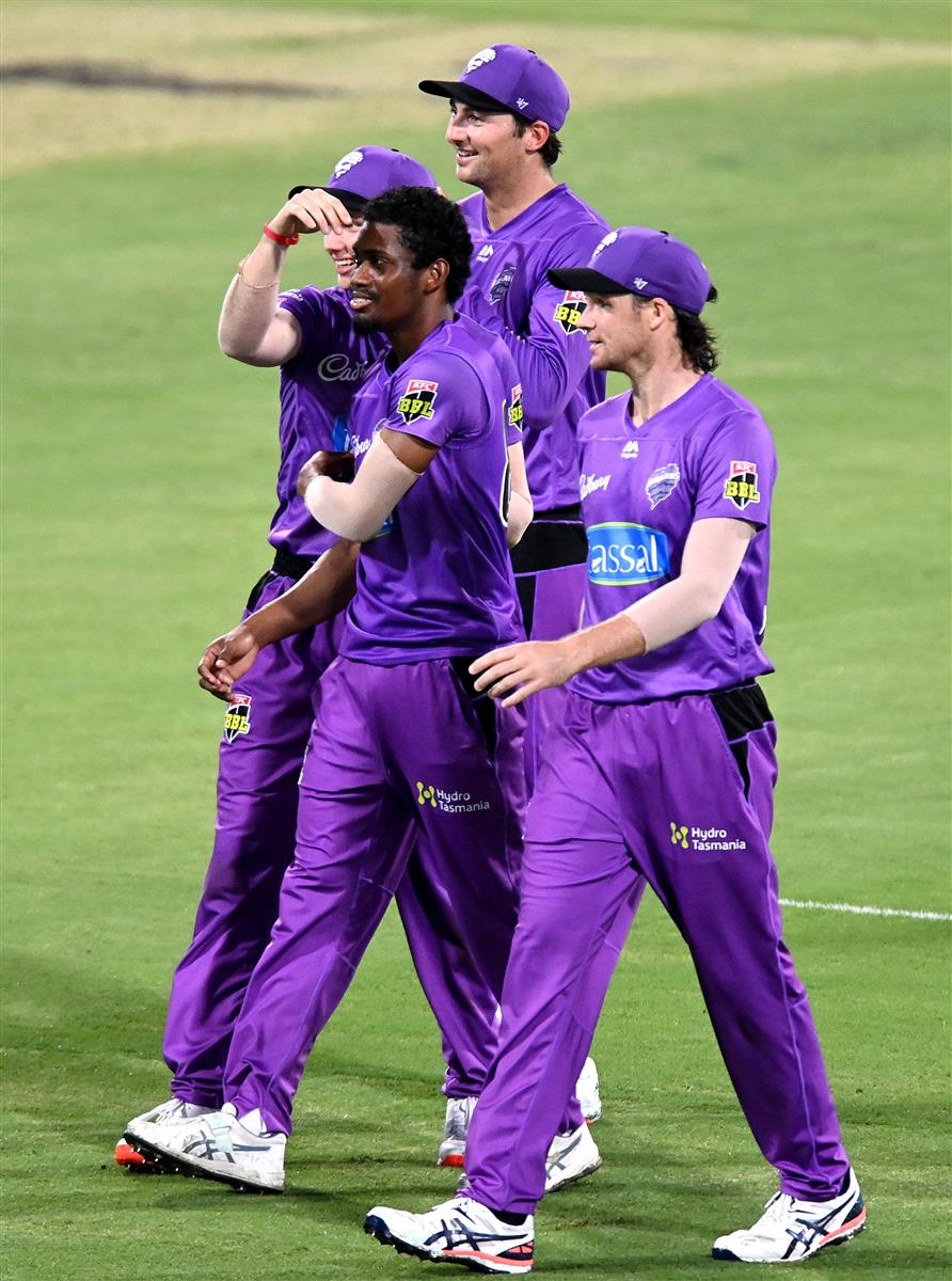 BRISBANE, AUSTRALIA - DECEMBER 30: Keemo Paul of the Hurricanes celebrates taking the wicket of Max Bryant of the Heat during the Big Bash League match between the Hobart Hurricanes and Brisbane Heat at The Gabba, on December 30, 2020, in Brisbane, Australia. (Photo by Bradley Kanaris/Getty Images)