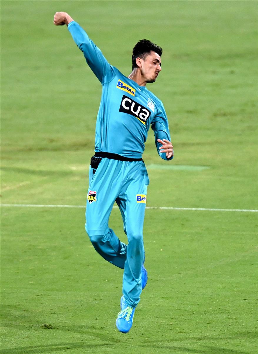 BRISBANE, AUSTRALIA - DECEMBER 30: Mujeeb Ur Rahman of the Heat celebrates taking the wicket of Dawid Malan of the Hurricanes during the Big Bash League match between the Hobart Hurricanes and Brisbane Heat at The Gabba, on December 30, 2020, in Brisbane, Australia. (Photo by Bradley Kanaris/Getty Images)