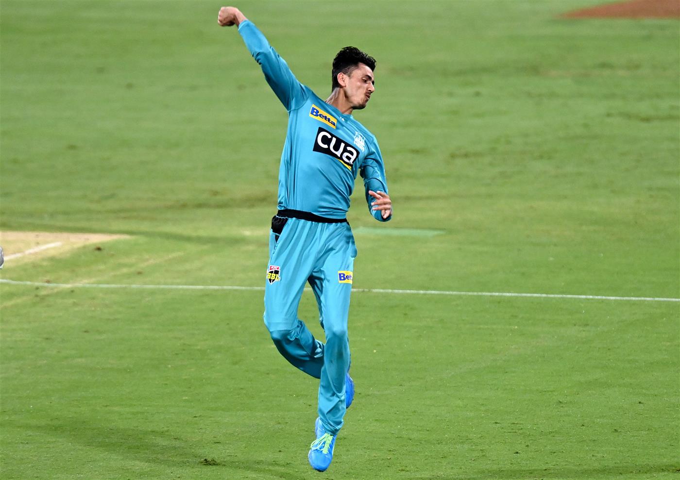 BRISBANE, AUSTRALIA - DECEMBER 30: Mujeeb Ur Rahman of the Heat celebrates taking the wicket of Dawid Malan of the Hurricanes during the Big Bash League match between the Hobart Hurricanes and Brisbane Heat at The Gabba, on December 30, 2020, in Brisbane, Australia. (Photo by Bradley Kanaris/Getty Images)