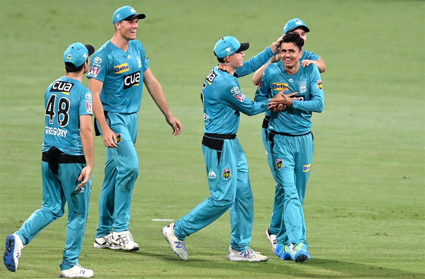 BRISBANE, AUSTRALIA - DECEMBER 30: Mujeeb Ur Rahman of the Heat celebrates taking the wicket of Scott Bolland of the Hurricanes during the Big Bash League match between the Hobart Hurricanes and Brisbane Heat at The Gabba, on December 30, 2020, in Brisbane, Australia. (Photo by Bradley Kanaris/Getty Images)