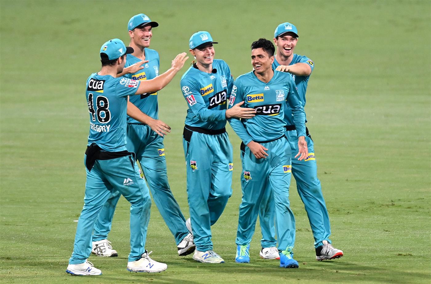 BRISBANE, AUSTRALIA - DECEMBER 30: Mujeeb Ur Rahman of the Heat celebrates taking the wicket of Scott Bolland of the Hurricanes during the Big Bash League match between the Hobart Hurricanes and Brisbane Heat at The Gabba, on December 30, 2020, in Brisbane, Australia. (Photo by Bradley Kanaris/Getty Images)