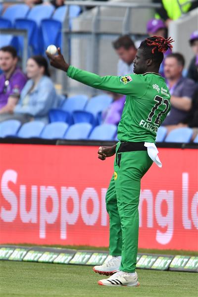 HOBART, AUSTRALIA - JANUARY 04: Andre Fletcher of the Stars celebrates taking a catch to dismiss  Ben McDermott of the Hurricanes during the Big Bash League match between the Melbourne Stars and the Hobart Hurricanes at Blundstone Arena, on January 04, 2021, in Hobart, Australia. (Photo by Steve Bell/Getty Images)
