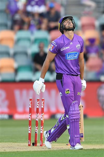 HOBART, AUSTRALIA - JANUARY 04:  Tim David of the Hurricanes reacts after losing his wicket during the Big Bash League match between the Melbourne Stars and the Hobart Hurricanes at Blundstone Arena, on January 04, 2021, in Hobart, Australia. (Photo by Steve Bell/Getty Images)