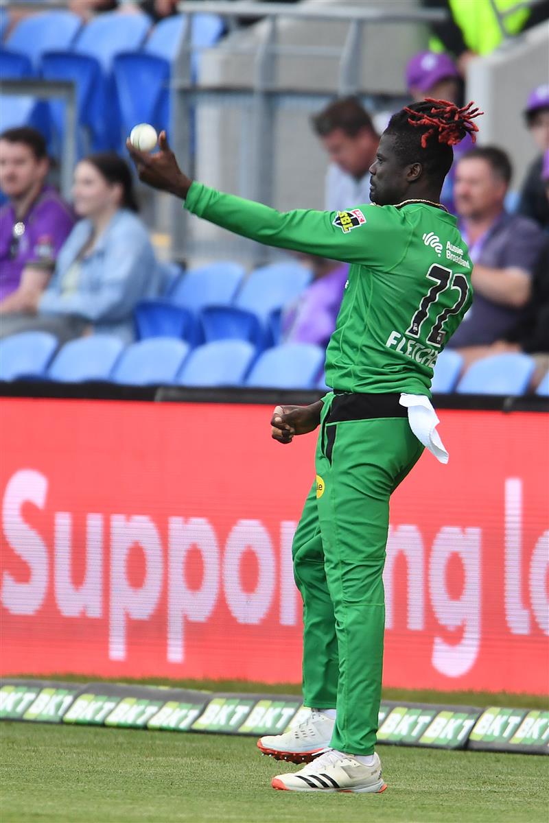 HOBART, AUSTRALIA - JANUARY 04: Andre Fletcher of the Stars celebrates taking a catch to dismiss  Ben McDermott of the Hurricanes during the Big Bash League match between the Melbourne Stars and the Hobart Hurricanes at Blundstone Arena, on January 04, 2021, in Hobart, Australia. (Photo by Steve Bell/Getty Images)