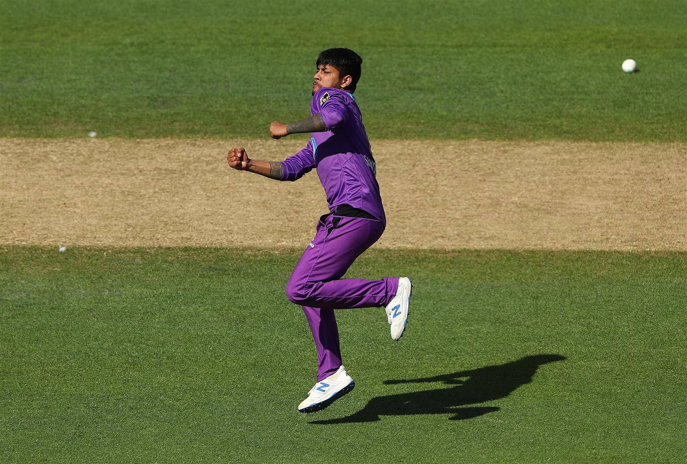 HOBART, AUSTRALIA - JANUARY 04: Sandeep Lamichhane of the Hurricanes celebrates taking the wicket of Glenn Maxwell of the Melbourne Stars during the Big Bash League match between the Melbourne Stars and the Hobart Hurricanes at Blundstone Arena, on January 04, 2021, in Hobart, Australia. (Photo by Robert Cianflone/Getty Images)