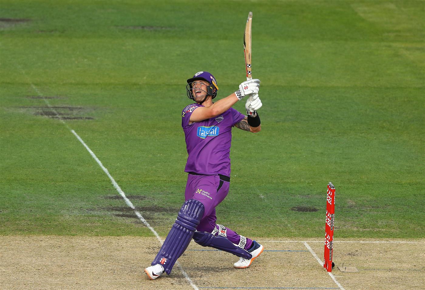 HOBART, AUSTRALIA - JANUARY 04: Ben McDermott of the Hurricanes hits a six onto the stadium roof during the Big Bash League match between the Melbourne Stars and the Hobart Hurricanes at Blundstone Arena, on January 04, 2021, in Hobart, Australia. (Photo by Robert Cianflone/Getty Images)