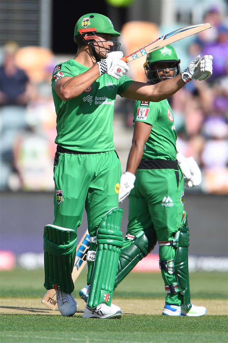 HOBART, AUSTRALIA - JANUARY 04:  Marcus Stoinis of the Stars raises his bat after scoring a half century during the Big Bash League match between the Melbourne Stars and the Hobart Hurricanes at Blundstone Arena on January 04, 2021 in Hobart, Australia. (Photo by Steve Bell/Getty Images)