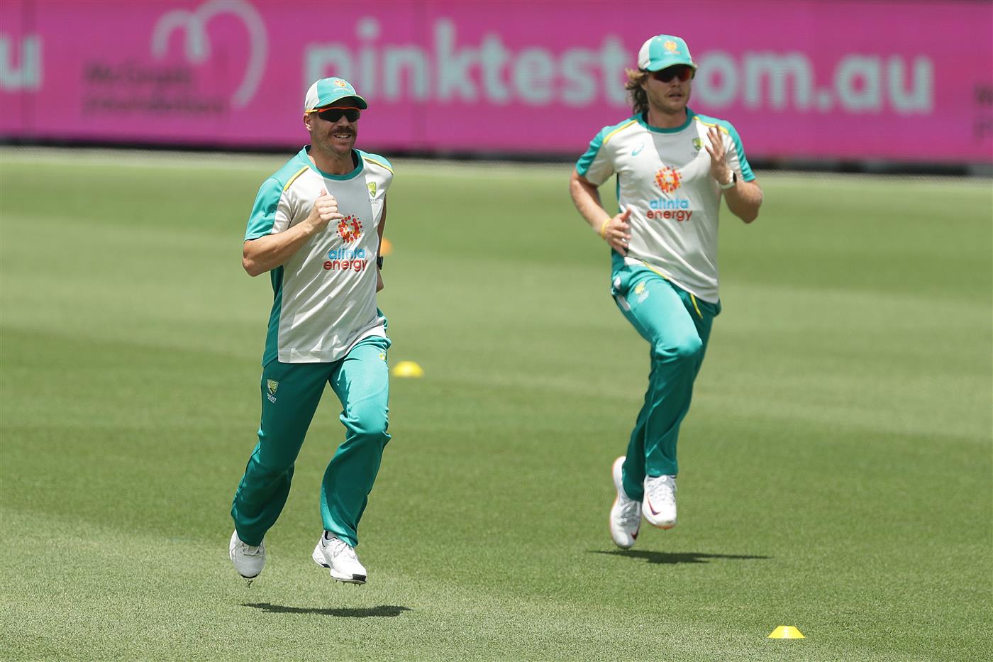 SYDNEY, AUSTRALIA - JANUARY 05: David Warner and Will Pucovski of Australia run during an Australian nets session at the Sydney Cricket Ground on January 05, 2021 in Sydney, Australia. (Photo by Mark Metcalfe/Getty Images)