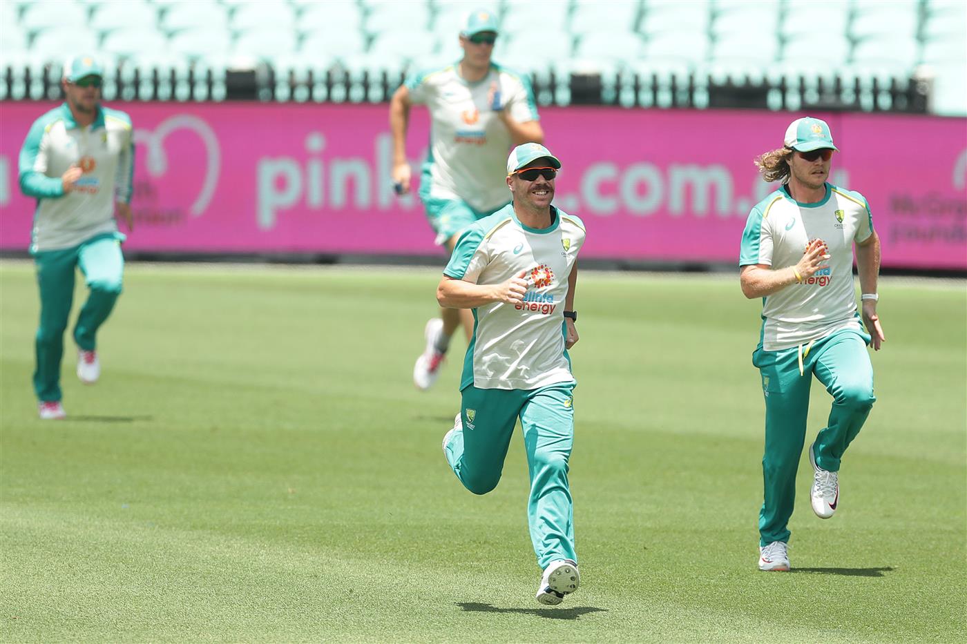 SYDNEY, AUSTRALIA - JANUARY 05: David Warner and Will Pucovski of Australia run during an Australian nets session at the Sydney Cricket Ground on January 05, 2021 in Sydney, Australia. (Photo by Mark Metcalfe/Getty Images)
