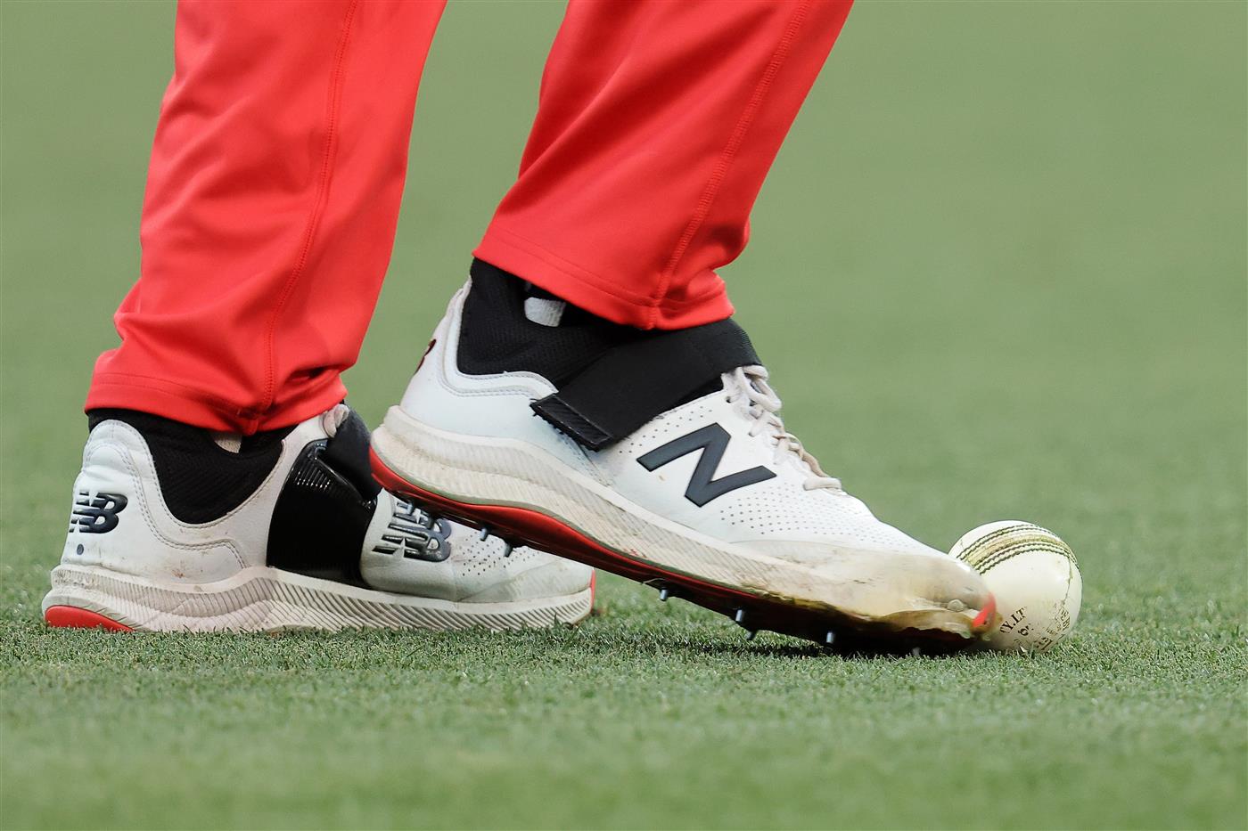 ADELAIDE, AUSTRALIA - JANUARY 05: Kane Richardson of the Renegades kicks the ball after it was returned from the crowd during the Big Bash League match between the Melbourne Renegades and the Adelaide Strikers at Adelaide Oval, on January 05, 2021, in Adelaide, Australia. (Photo by Daniel Kalisz/Getty Images)