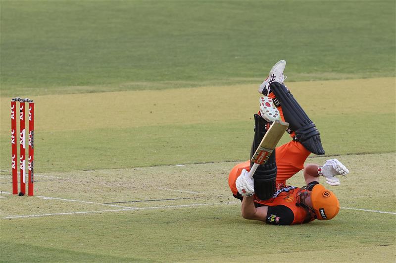 PERTH, AUSTRALIA - JANUARY 06: Ashton Turner of the Scorchers takes a tumble after playing a ramp shot to the boundary during the Big Bash League match between the Perth Scorchers and the Sydney Sixers at Optus Stadium, on January 06, 2021, in Perth, Australia. (Photo by Paul Kane/Getty Images)