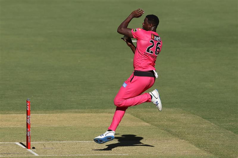 PERTH, AUSTRALIA - JANUARY 06: Carlos Brathwaite of the Sixers bowls during the Big Bash League match between the Perth Scorchers and the Sydney Sixers at Optus Stadium, on January 06, 2021, in Perth, Australia. (Photo by Paul Kane/Getty Images)