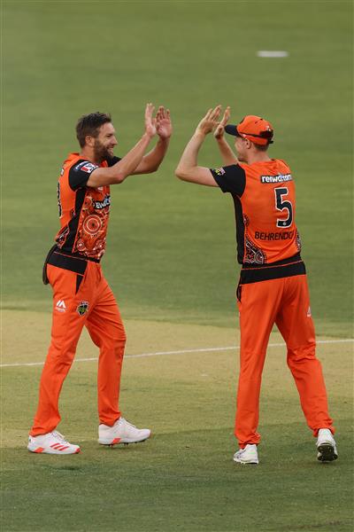 PERTH, AUSTRALIA - JANUARY 06: Andrew Tye and Jason Behrendorff of the Scorchers celebrate the wicket of Daniel Christian of the Sixers during the Big Bash League match between the Perth Scorchers and the Sydney Sixers at Optus Stadium, on January 06, 2021, in Perth, Australia. (Photo by Paul Kane/Getty Images)