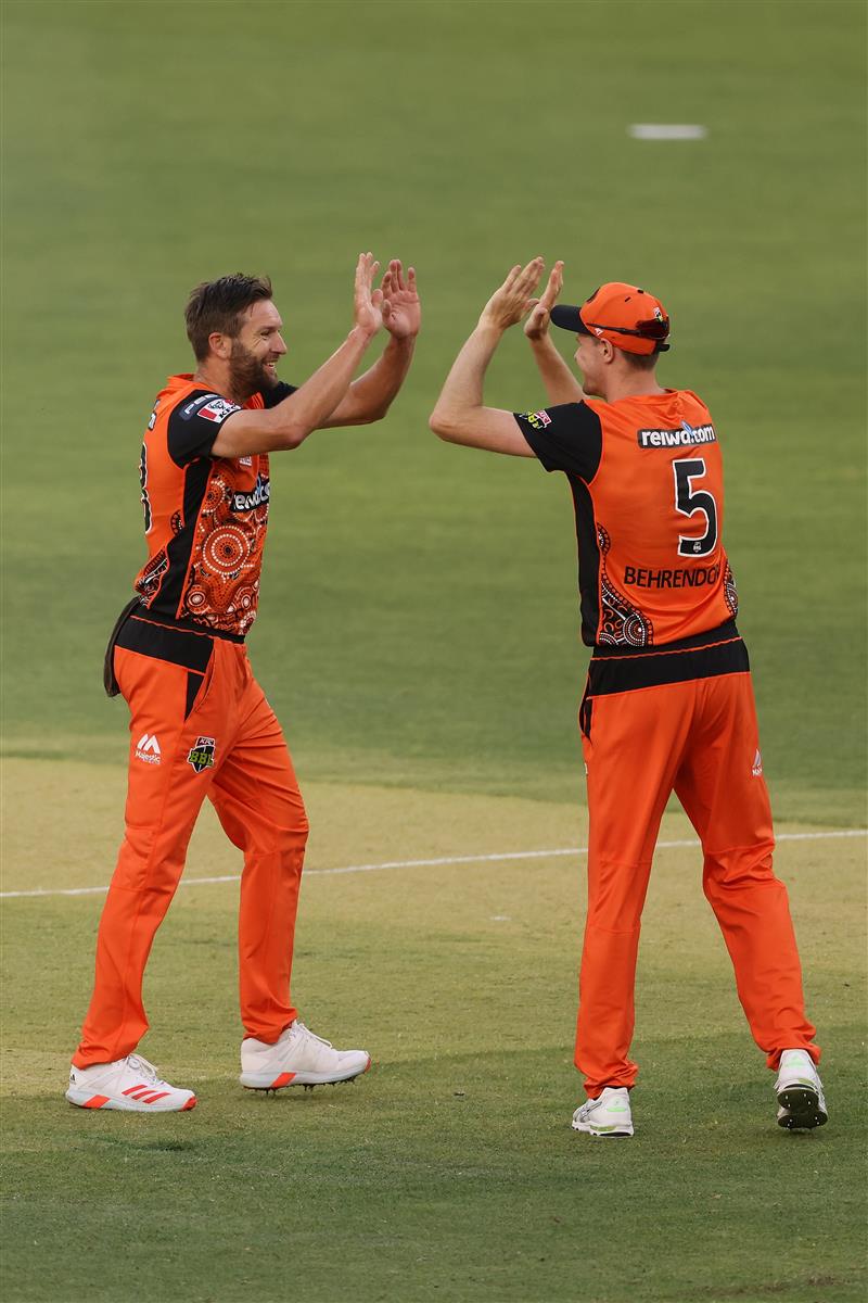 PERTH, AUSTRALIA - JANUARY 06: Andrew Tye and Jason Behrendorff of the Scorchers celebrate the wicket of Daniel Christian of the Sixers during the Big Bash League match between the Perth Scorchers and the Sydney Sixers at Optus Stadium, on January 06, 2021, in Perth, Australia. (Photo by Paul Kane/Getty Images)