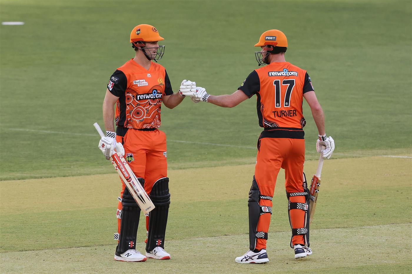 PERTH, AUSTRALIA - JANUARY 06: Mitch Marsh of the Scorchers celebrates with Ashton Turner after reaching his half century during the Big Bash League match between the Perth Scorchers and the Sydney Sixers at Optus Stadium, on January 06, 2021, in Perth, Australia. (Photo by Paul Kane/Getty Images)