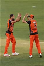 PERTH, AUSTRALIA - JANUARY 06: Andrew Tye and Jason Behrendorff of the Scorchers celebrate the wicket of Daniel Christian of the Sixers during the Big Bash League match between the Perth Scorchers and the Sydney Sixers at Optus Stadium, on January 06, 2021, in Perth, Australia. (Photo by Paul Kane/Getty Images)