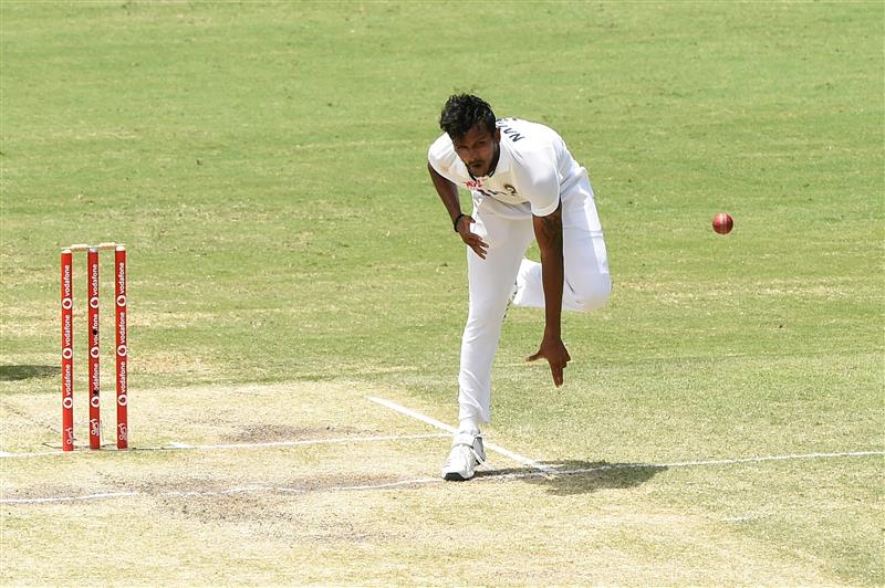 BRISBANE, AUSTRALIA - JANUARY 18:  Thangarasu Natarajan of India bowls during day four of the 4th Test Match in the series between Australia and India at The Gabba on January 18, 2021 in Brisbane, Australia. (Photo by Matt Roberts/Getty Images)