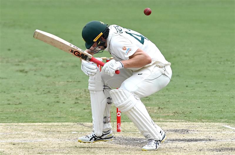 BRISBANE, AUSTRALIA - JANUARY 18: Cameron Green of Australia ducks a bouncer during day four of the 4th Test Match in the series between Australia and India at The Gabba on January 18, 2021 in Brisbane, Australia. (Photo by Bradley Kanaris/Getty Images)
