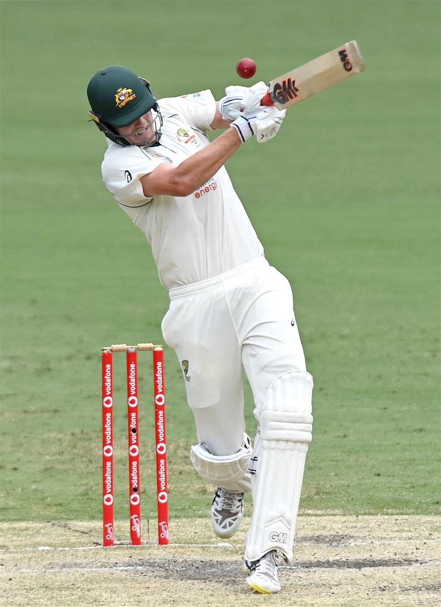 BRISBANE, AUSTRALIA - JANUARY 18: Cameron Green of Australia plays a shot during day four of the 4th Test Match in the series between Australia and India at The Gabba on January 18, 2021 in Brisbane, Australia. (Photo by Bradley Kanaris/Getty Images)