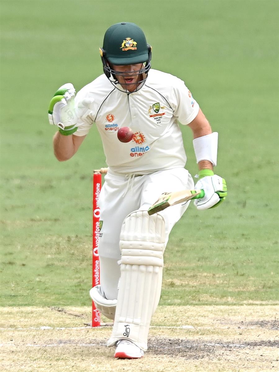 BRISBANE, AUSTRALIA - JANUARY 18: Tim Paine of Australia bats during day four of the 4th Test Match in the series between Australia and India at The Gabba on January 18, 2021 in Brisbane, Australia. (Photo by Bradley Kanaris/Getty Images)