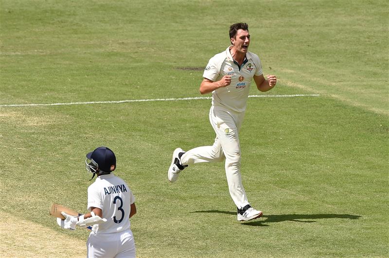 BRISBANE, AUSTRALIA - JANUARY 19: Pat Cummins of Australia celebrates taking the wicket of Ajinkya Rahane of India during day five of the 4th Test Match in the series between Australia and India at The Gabba on January 19, 2021 in Brisbane, Australia. (Photo by Matt Roberts/Getty Images)