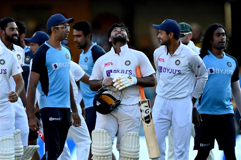 BRISBANE, AUSTRALIA - JANUARY 19: Rishabh Pant of India celebrates victory with his team mates after day five of the 4th Test Match in the series between Australia and India at The Gabba on January 19, 2021 in Brisbane, Australia. (Photo by Bradley Kanaris/Getty Images)