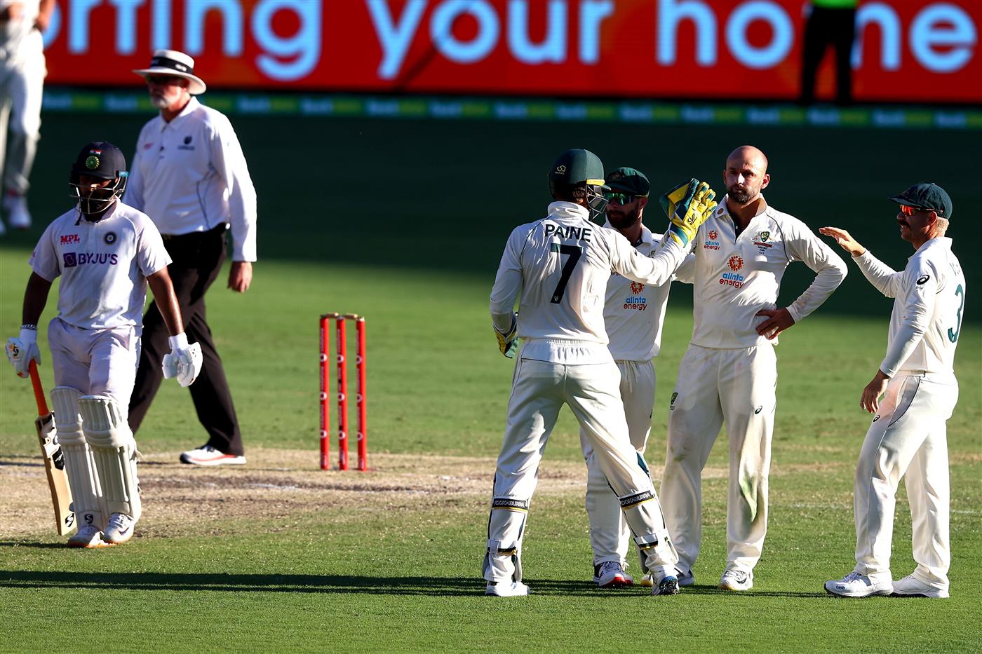 BRISBANE, AUSTRALIA - JANUARY 19: Australia celebrate the wicket of Washington Sundar of India during day five of the 4th Test Match in the series between Australia and India at The Gabba on January 19, 2021 in Brisbane, Australia. (Photo by Matt Roberts/Getty Images)