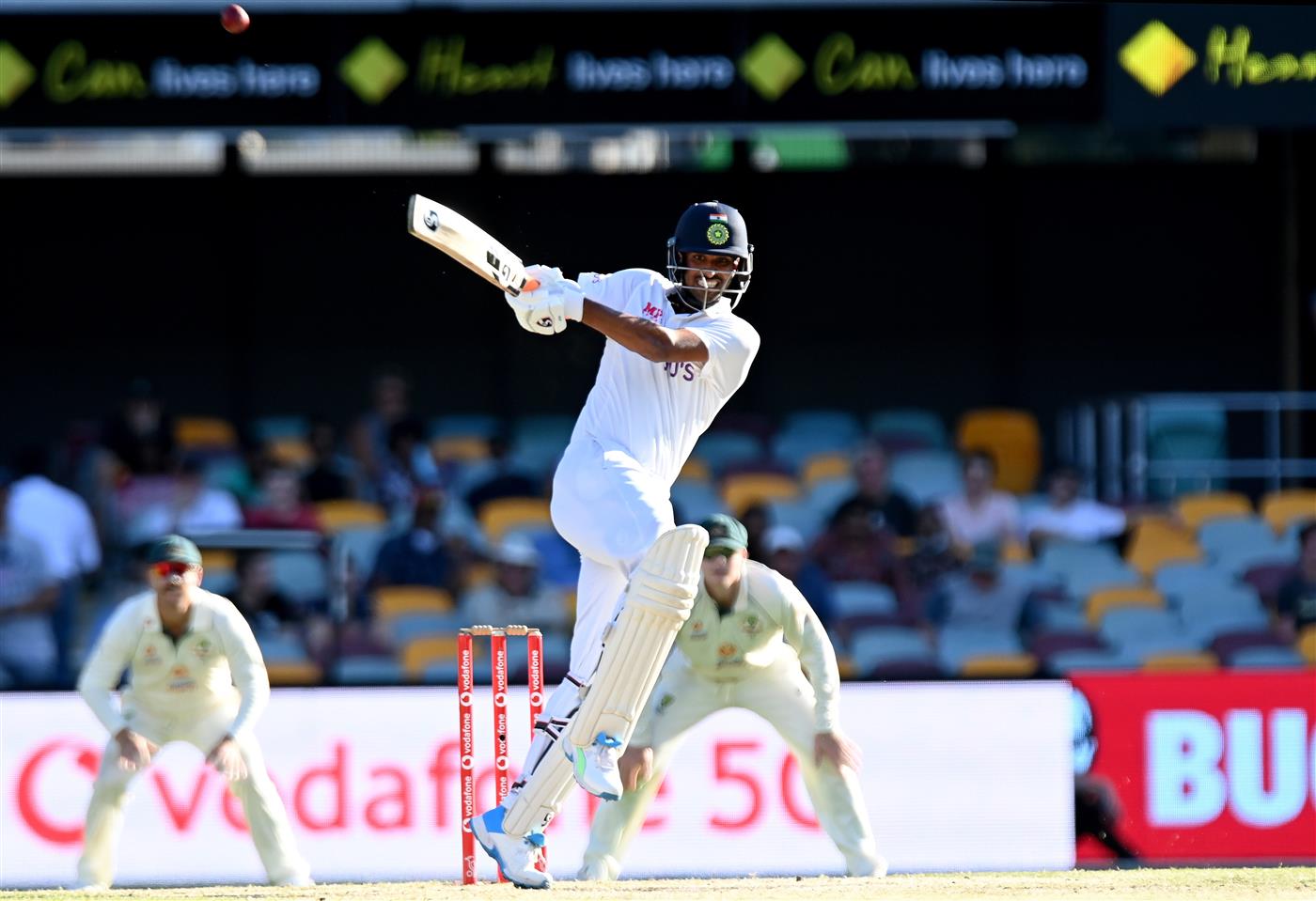 BRISBANE, AUSTRALIA - JANUARY 19: Washington Sundar of India hits the ball over the boundary for a six during day five of the 4th Test Match in the series between Australia and India at The Gabba on January 19, 2021 in Brisbane, Australia. (Photo by Bradley Kanaris/Getty Images)