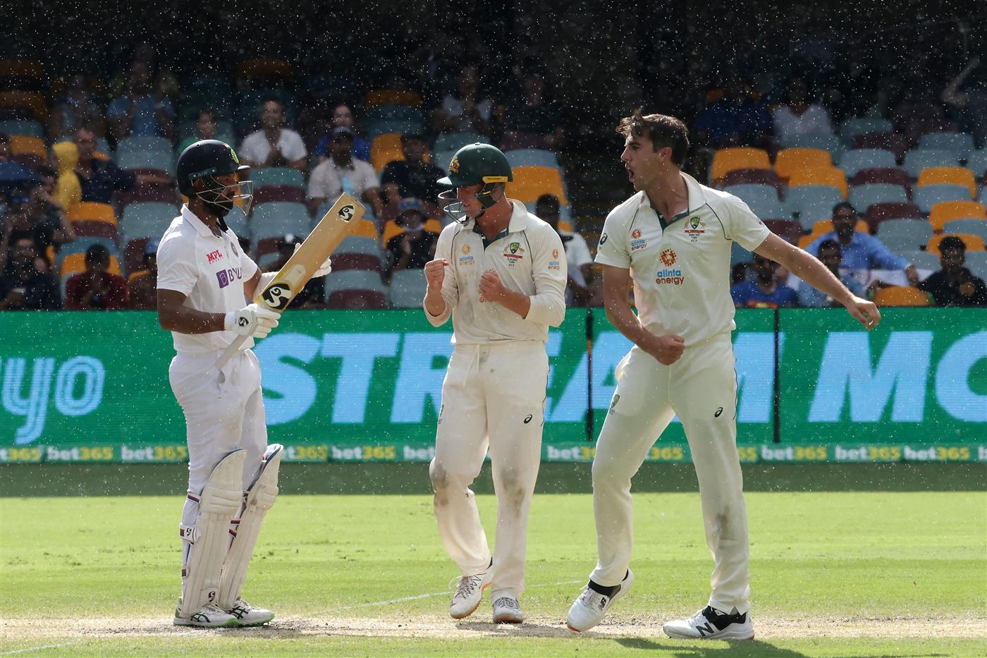 BRISBANE, AUSTRALIA - JANUARY 19: Pat Cummins of Australia and team mates celebrate taking the wicket of Cheteshwar Pujara during day five of the 4th Test Match in the series between Australia and India at The Gabba on January 19, 2021 in Brisbane, Australia. (Photo by Bradley Kanaris/Getty Images)