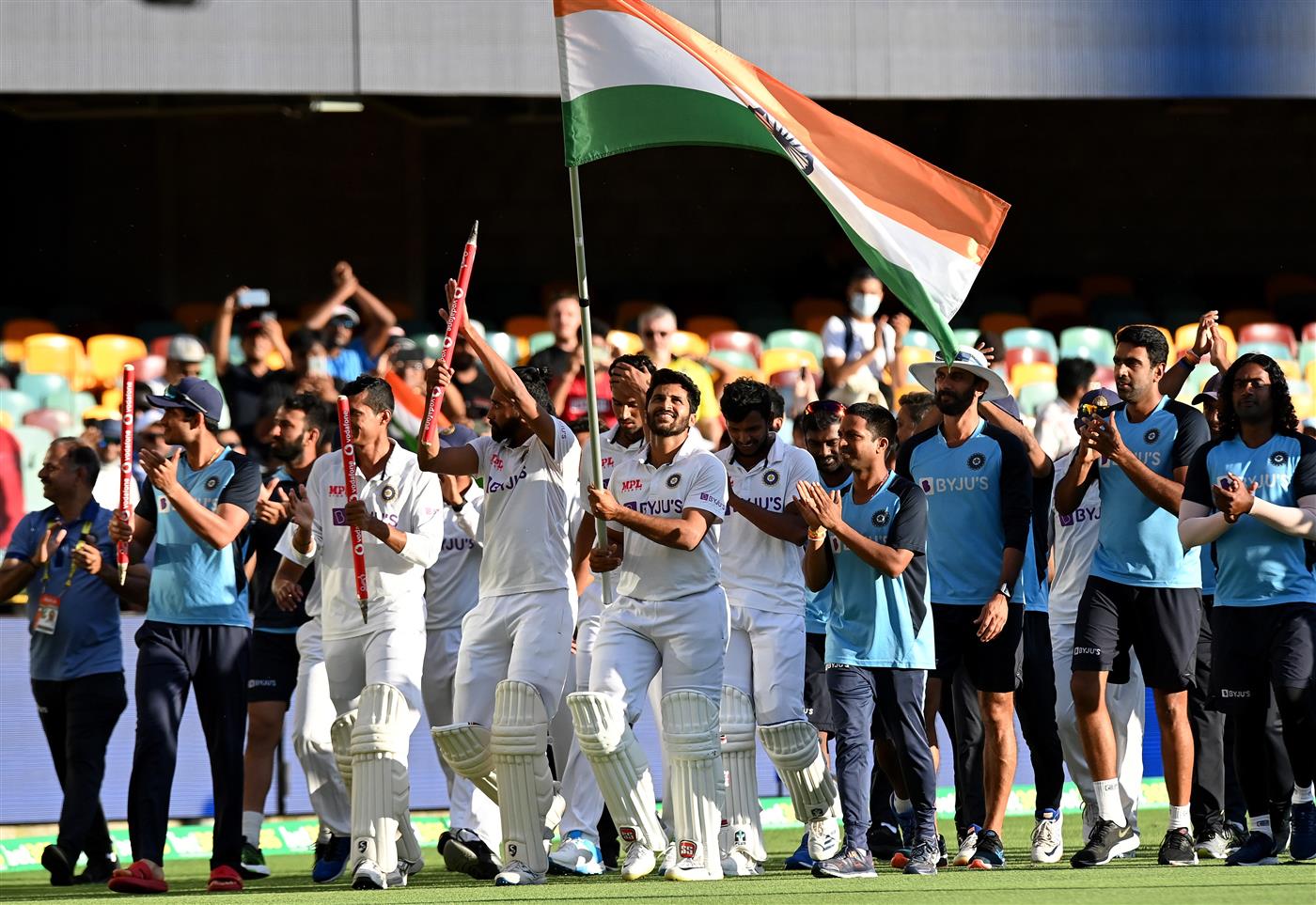 BRISBANE, AUSTRALIA - JANUARY 19: Rishabh Pant of India celebrates victory with his team mates after day five of the 4th Test Match in the series between Australia and India at The Gabba on January 19, 2021 in Brisbane, Australia. (Photo by Bradley Kanaris/Getty Images)