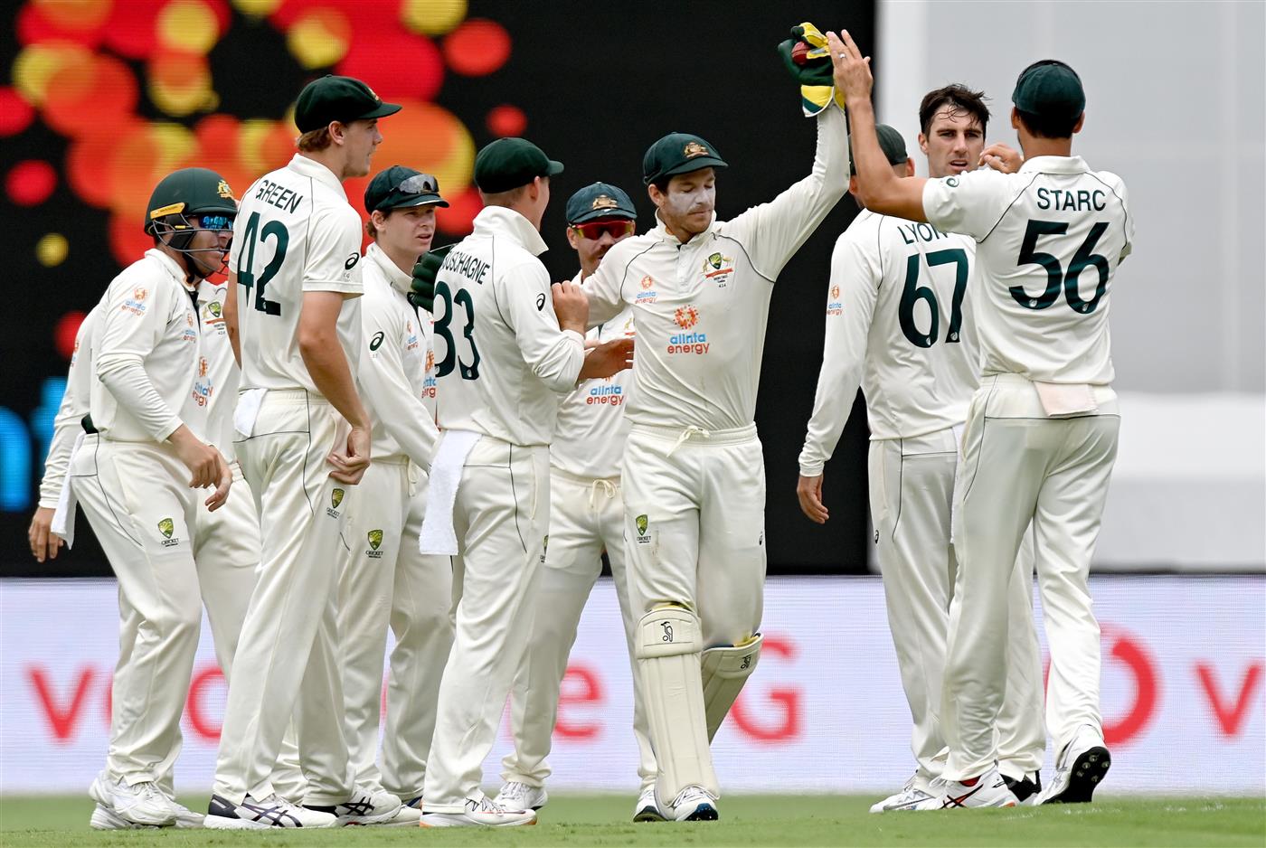 BRISBANE, AUSTRALIA - JANUARY 19: Pat Cummins of Australia and team mates celebrate taking the wicket of Rohit Sharma of India during day five of the 4th Test Match in the series between Australia and India at The Gabba on January 19, 2021 in Brisbane, Australia. (Photo by Bradley Kanaris/Getty Images)